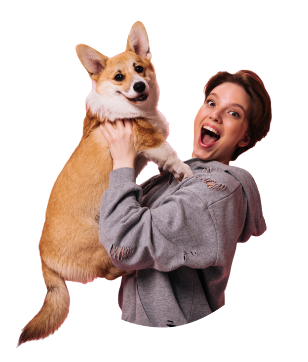 Pet parent joyfully lifting her Corgi